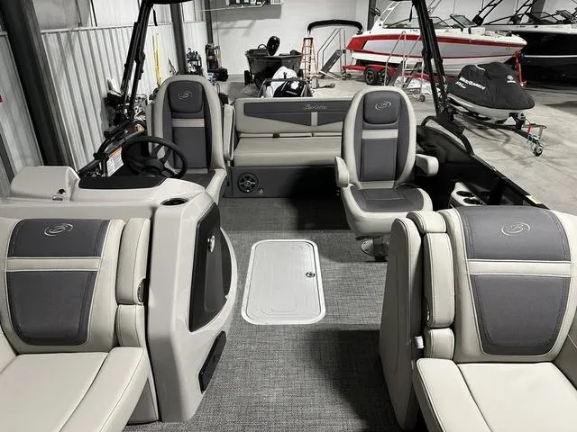 Slide: The Image of 2025 Barletta Cabrio C22UC boat interior with plush seating and modern design. - 15