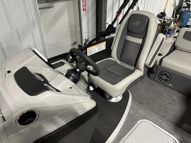 Slide: The Image of 2025 Barletta Cabrio C22UC boat interior with open storage compartment. - 19