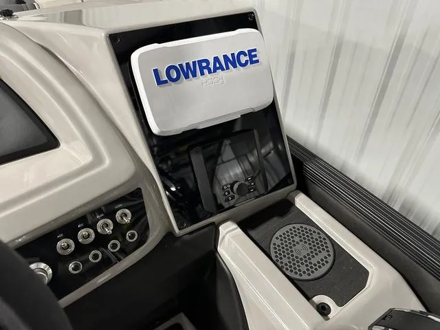 Slide: The Image of 2025 Barletta Cabrio C22UC boat interior storage compartment with open hatch. - 23