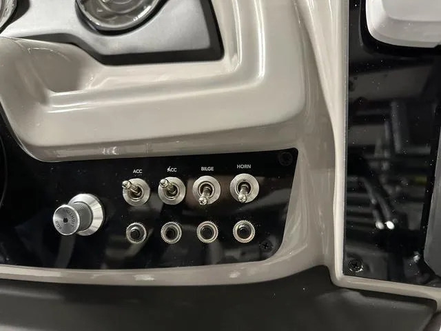 Slide: The Image of 2025 Barletta Cabrio C22UC boat dashboard with Lowrance electronics and control panel. - 24