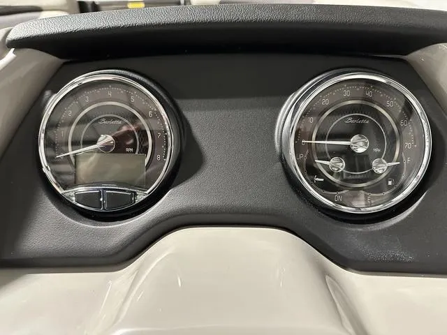 Slide: The Image of Control panel of 2025 Barletta Boats Cabrio C22UC with switches and knobs. - 25