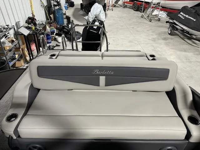 Slide: The Image of Interior controls of 2025 Barletta Boats Cabrio C22UC, featuring steering and dashboard. - 30