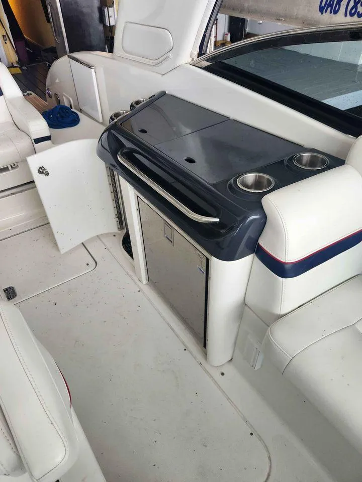 Slide: The Image of 2018 Formula 310 Sun Sport interior with kitchenette and seating area. - 16