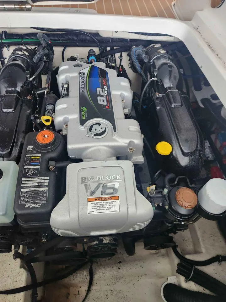 Slide: The Image of 2018 Formula 310 Sun Sport engine compartment with MerCruiser engine. - 18