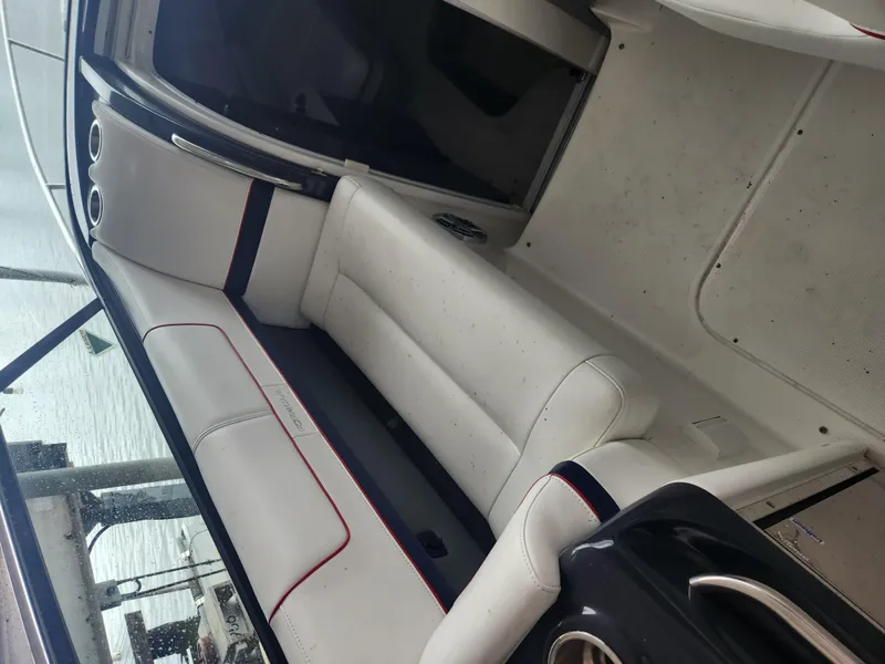 Slide: The Image of 2018 Formula 310 Sun Sport interior with white leather seating. - 23