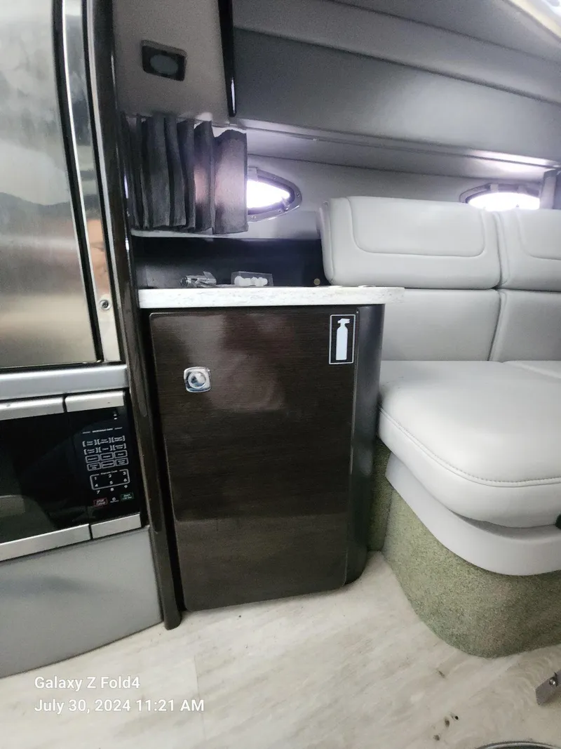 Slide: The Image of Interior of 2018 Formula 310 Sun Sport boat with seating and cabinetry. - 39