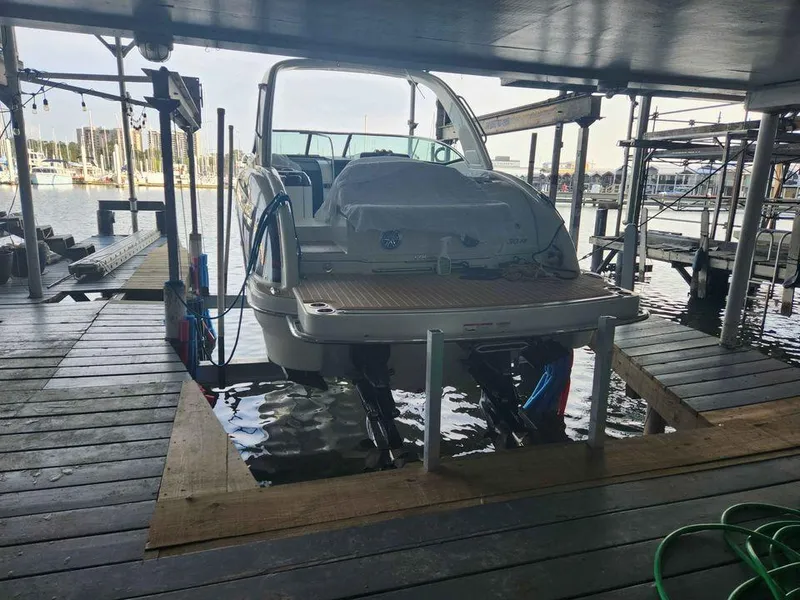 Slide: The Image of 2018 Formula 310 Sun Sport boat docked in a covered marina. - 4