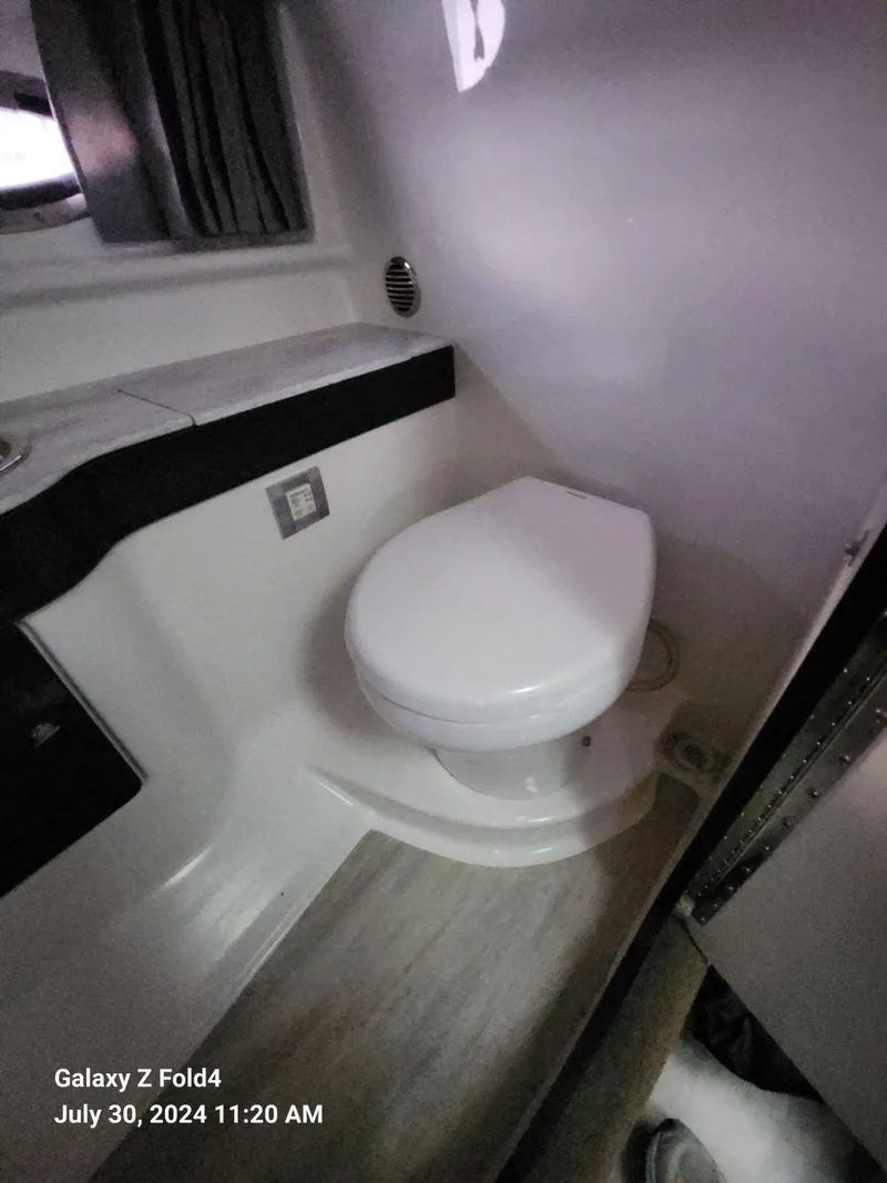 Slide: The Image of 2018 Formula 310 Sun Sport boat bathroom interior with toilet and modern design. - 40