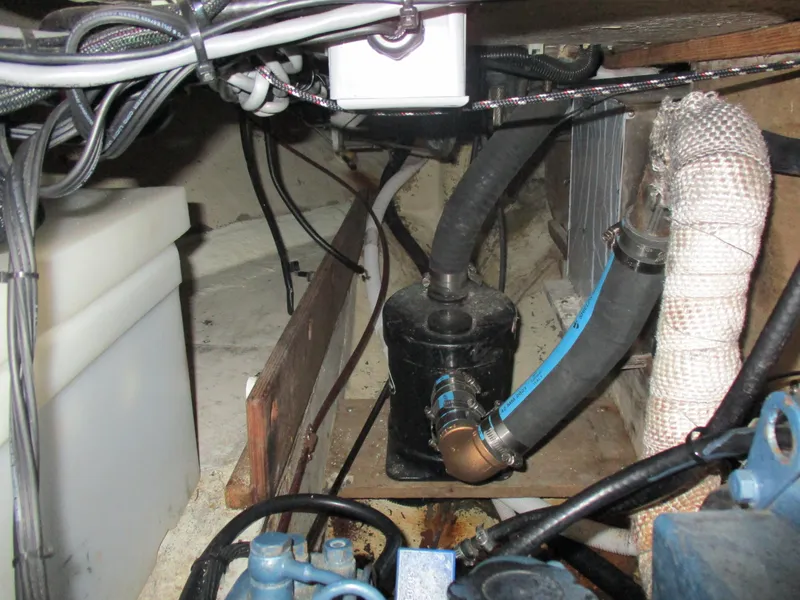 Slide: The Image of Engine compartment of a 1979 CAL 31 sailboat, showing hoses and wiring. - 27