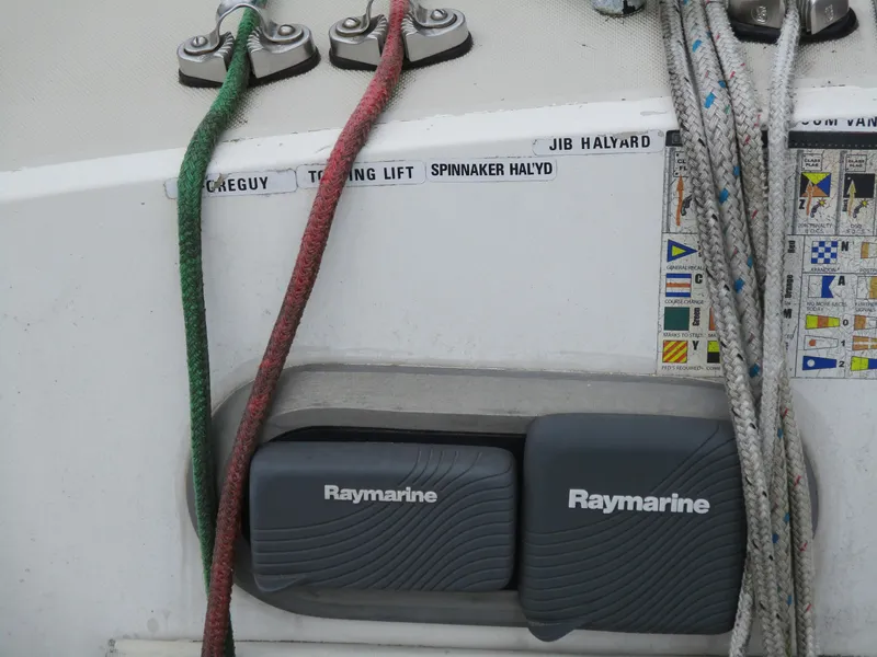 Slide: The Image of Sailboat control panel with Raymarine equipment and labeled ropes, CAL 31, 1979 model. - 5