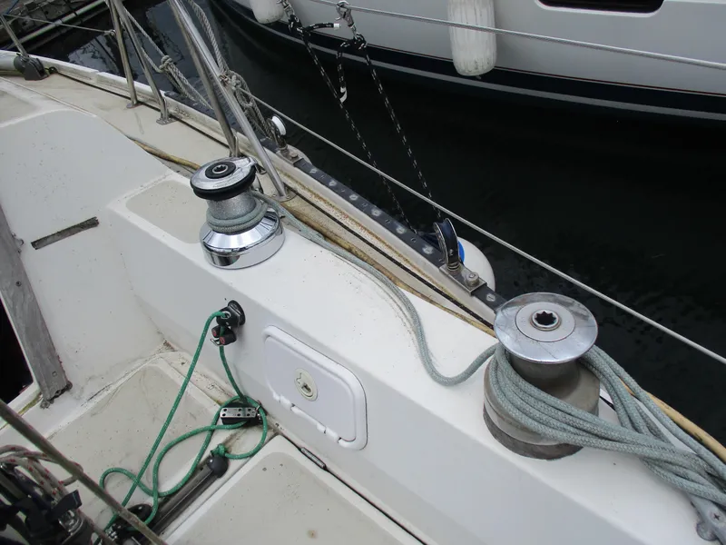 Slide: The Image of Deck of a 1979 CAL 31 sailboat with winches and ropes. - 7