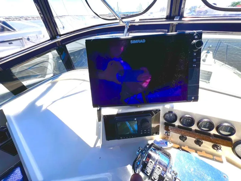 Slide: The Image of 1987 Tollycraft 44 Cockpit Motoryacht helm with Simrad navigation system. - 19