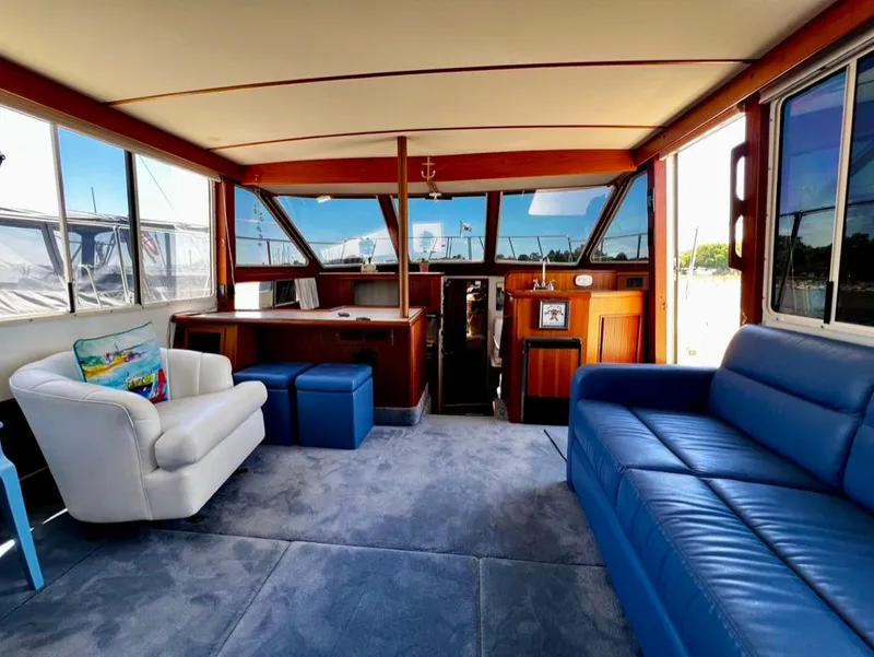 Slide: The Image of Interior of 1987 Tollycraft 44 Cockpit Motoryacht with blue and white seating. - 20
