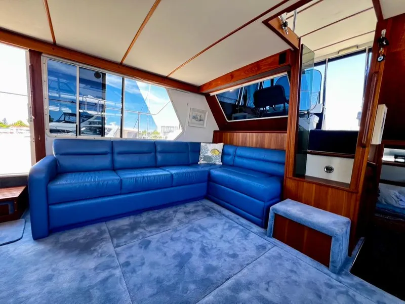 Slide: The Image of Interior of 1987 Tollycraft 44 Cockpit Motoryacht with blue seating and carpet. - 23