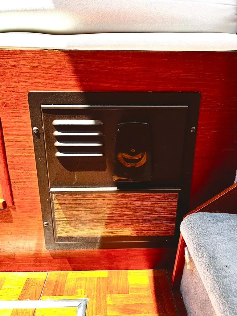 Slide: The Image of 1987 Tollycraft 44 Cockpit Motoryacht interior vent and wood paneling. - 36