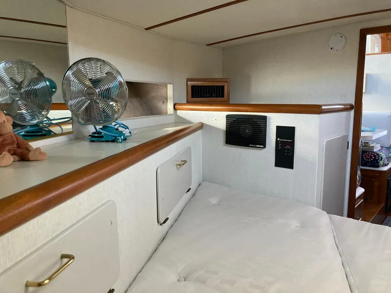 Slide: The Image of Interior of 1987 Tollycraft 44 Cockpit Motor Yacht with fans and storage. - 44