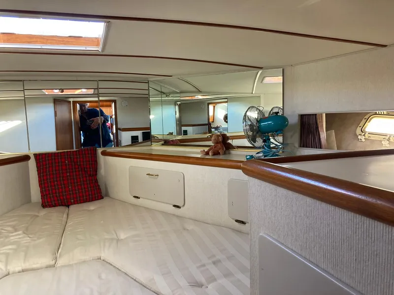 Slide: The Image of Interior of 1987 Tollycraft 44 Cockpit Motor Yacht with cozy cabin and fan. - 46