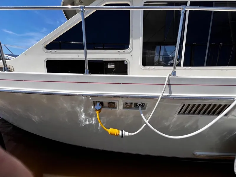 Slide: The Image of 1987 Tollycraft 44 Cockpit Motoryacht side view with power cables connected. - 9