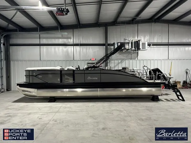 Slide: The Image of 2025 Barletta Cabrio C24UE pontoon boat in showroom at Buckeye Sports Center. - 1