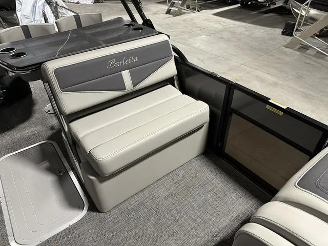 Slide: The Image of 2025 Barletta Boats Cabrio C24UE interior seating area with gray and white upholstery. - 15
