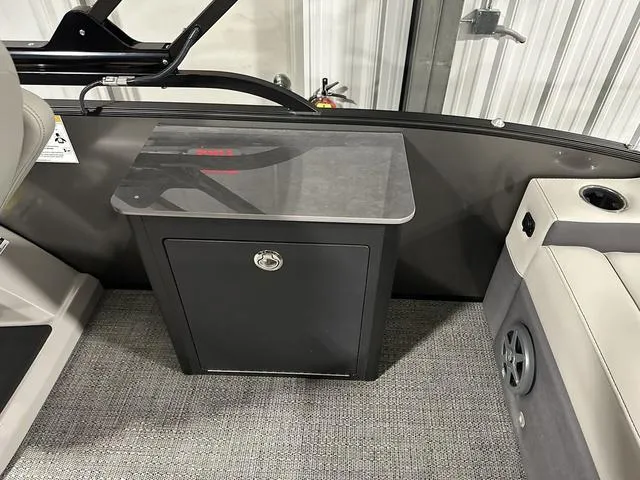 Slide: The Image of Barletta Boats Cabrio C24UE 2025 interior storage cabinet and seating area. - 18