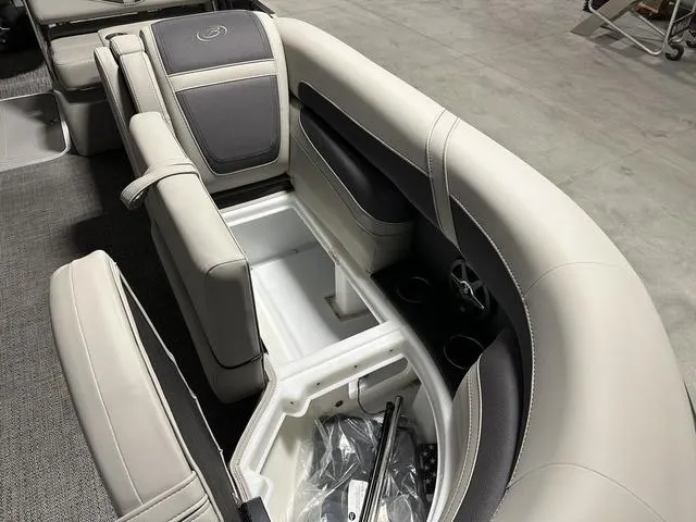 Slide: The Image of 2025 Barletta Boats Cabrio C24UE interior seating with storage compartments. - 23