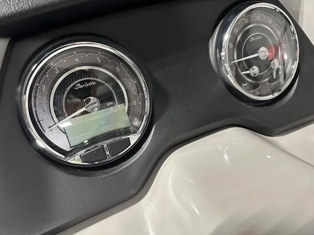 Slide: The Image of Close-up of 2025 Barletta Boats Cabrio C24UE dashboard gauges. - 28