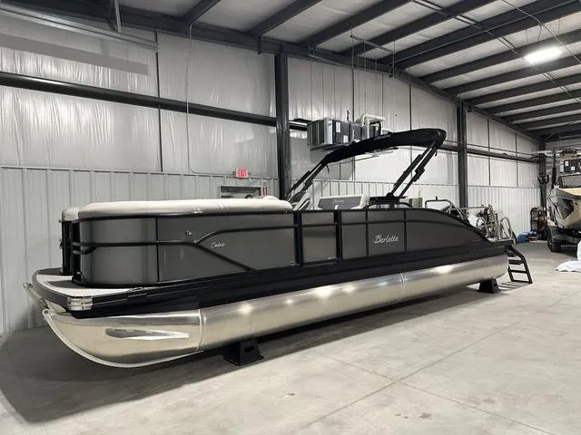 Slide: The Image of 2025 Barletta Boats Cabrio C24UE pontoon boat in a warehouse. - 3