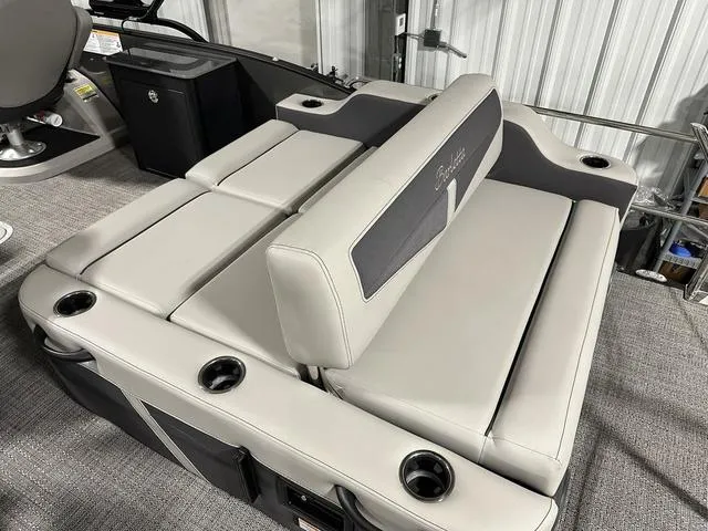 Slide: The Image of 2025 Barletta Boats Cabrio C24UE luxury seating with cup holders and storage. - 32