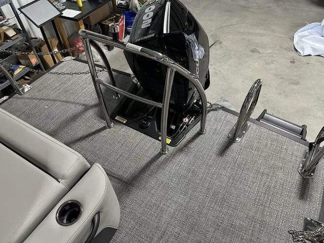 Slide: The Image of 2025 Barletta Boats Cabrio C24UE pontoon boat with outboard motor and rear deck. - 33