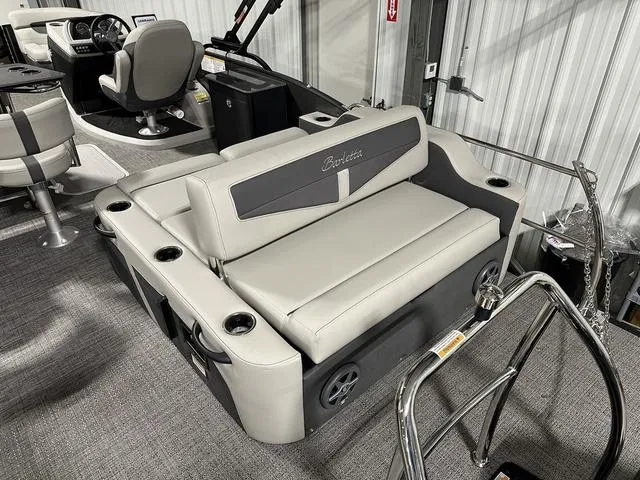 Slide: The Image of 2025 Barletta Boats Cabrio C24UE interior seating and helm station. - 7