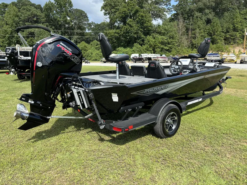 Slide: The Image of 2024 Ranger RT188P fishing boat with Mercury Pro XS engine on grassy area. - 16