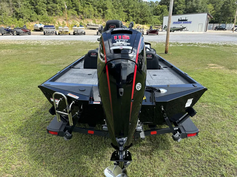 Slide: The Image of 2024 Ranger RT188P boat with Mercury 115 engine, parked on grass near dealership. - 17