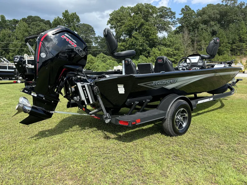 Slide: The Image of 2024 Ranger RT188P boat with Mercury Pro XS engine on grassy field. - 3