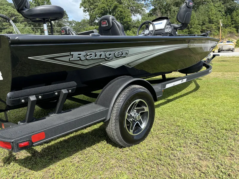 Slide: The Image of 2024 Ranger RT188P boat on trailer, parked on grass. - 4