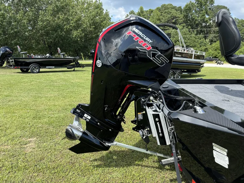 Slide: The Image of 2024 Ranger RT188P boat with Mercury Pro XS engine on grassy field. - 8