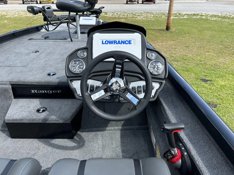 Slide: The Image of 2024 Ranger RT188P boat dashboard with Lowrance electronics and steering wheel. - 9