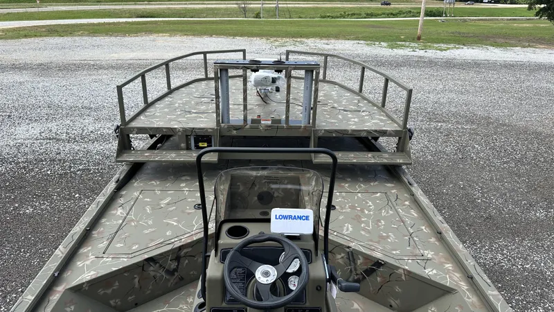 Slide: The Image of 2024 Tracker Grizzly 2072 CC SportMan boat with camo design and Lowrance equipment. - 11