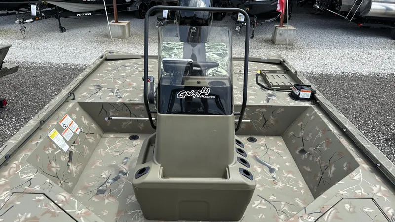 Slide: The Image of 2024 Tracker Grizzly 2072 CC SportMan boat interior with camouflage design. - 14