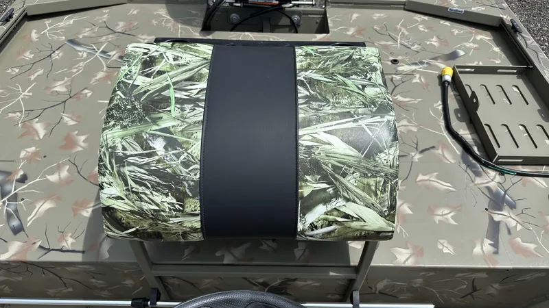 Slide: The Image of 2024 Tracker Grizzly 2072 CC SportMan boat seat with camouflage pattern. - 7