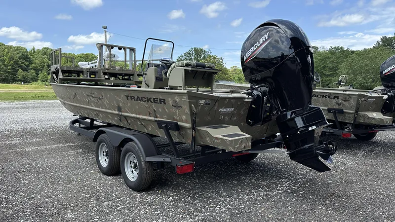 Slide: The Image of 2024 Tracker Grizzly 2072 CC SportMan boat with Mercury engine on trailer. - 9