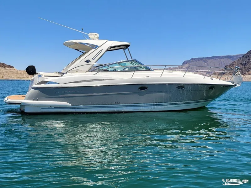 Slide: The Image of 2008 Monterey 350 Sport Yacht on clear blue water with mountainous background. - 12