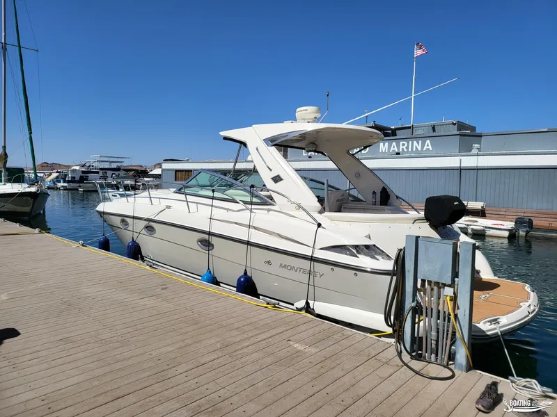 Slide: The Image of 2008 Monterey 350 Sport Yacht docked at a marina on a sunny day. - 13