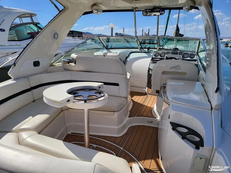 Slide: The Image of 2008 Monterey 350Sport Yacht interior with seating, table, and helm station. - 19