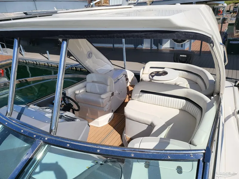Slide: The Image of 2008 Monterey 350Sport Yacht interior with white leather seating and wooden flooring. - 22