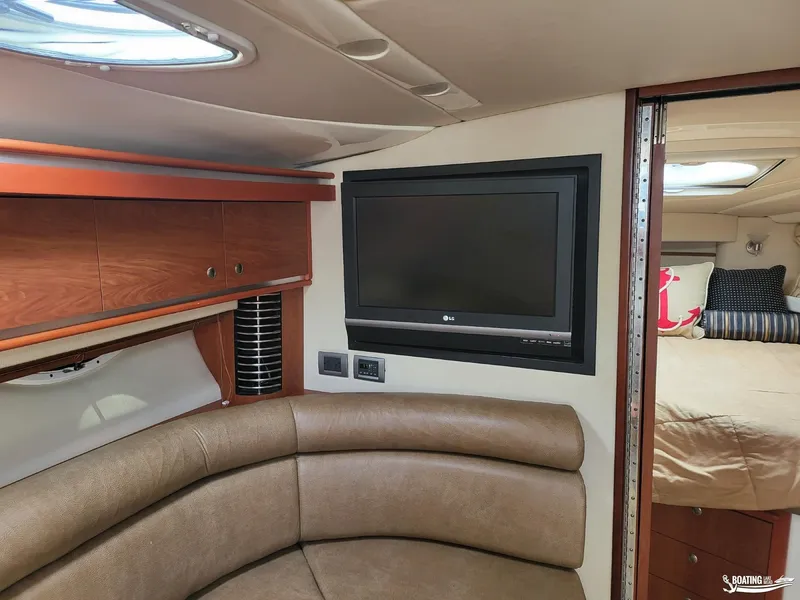 Slide: The Image of Interior of 2008 Monterey 350 Sport Yacht with TV, seating, and bedroom. - 25
