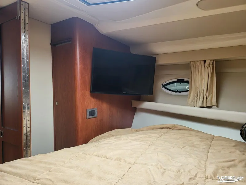 Slide: The Image of Interior cabin of a 2008 Monterey 350Sport Yacht with TV and porthole window. - 31