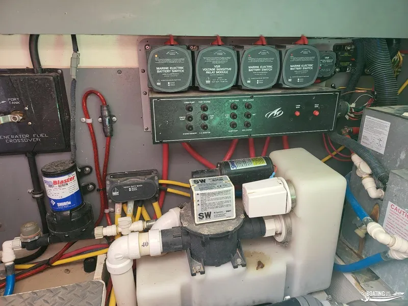 Slide: The Image of 2008 Monterey 350Sport Yacht engine room with battery switches and fuel crossover. - 34