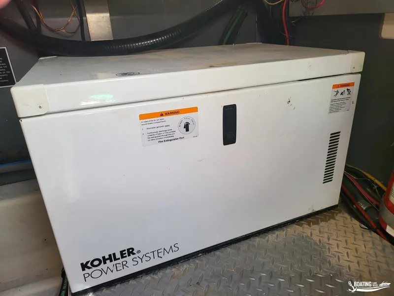 Slide: The Image of Kohler Power Systems generator in a 2008 Monterey 350 Sport Yacht engine room. - 35