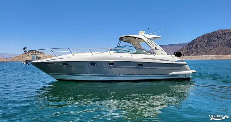 Slide: The Image of 2008 Monterey 350Sport Yacht on a serene lake with mountainous backdrop. - 5